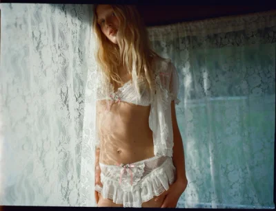 Photo of Layered Lace Bralette in Ivory on model, view 1