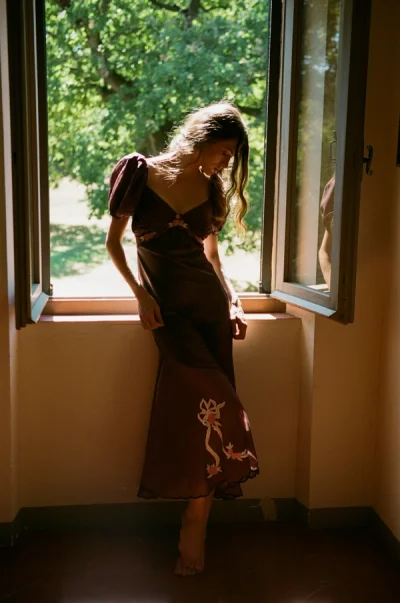 Photo of Loralai Midi Dress in Neutral on model, view 1
