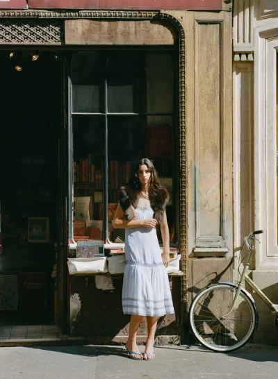 Photo of Piper Polka Dot Midi Dress in Blue on model, view 1