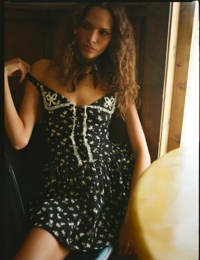 Photo of Western Wildflower Mini Dress in Black on model, view 1