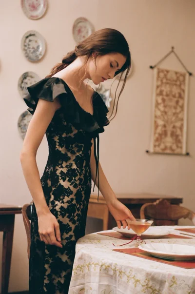 Photo of Isadore Midi Dress in Black on model, view 1